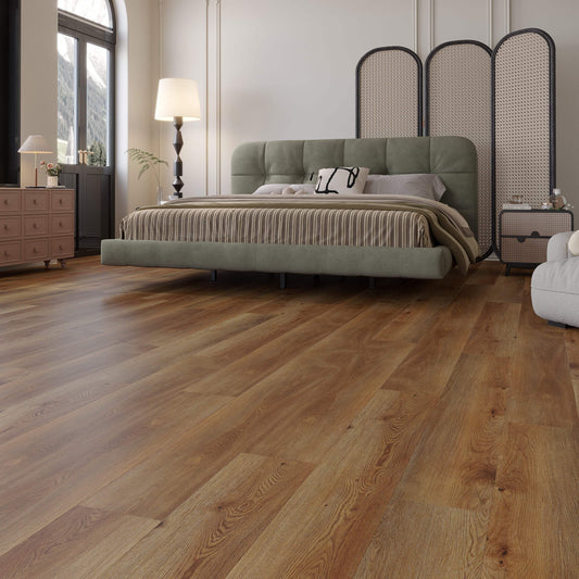 Modern bedroom with natural hardwood flooring, upholstered bed, and accent furniture.