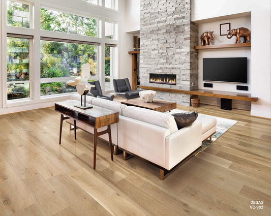 Modern living room with large windows, light hardwood flooring, stone fireplace, and contemporary decor.