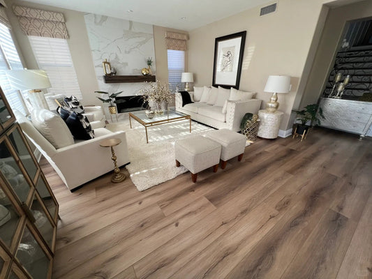 Beige and brown vinyl plank flooring in a modern living room with neutral decor
