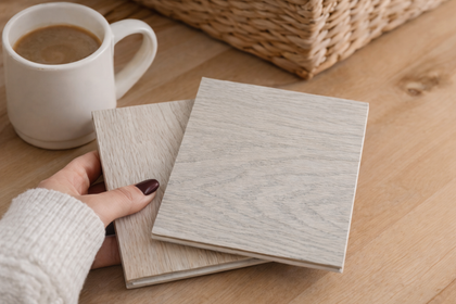 Premium oak hardwood flooring samples in light natural wood tones, close-up view